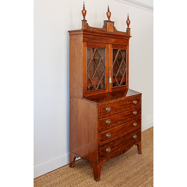 This elegant Federal-period secretary bookcase exemplifies the refined proportions and craftsmanship that defined early...