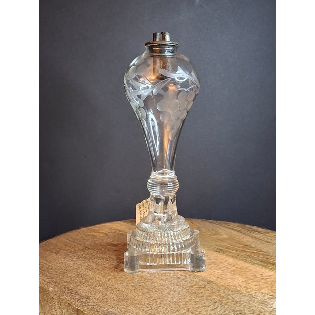 An extraordinary, investment-grade piece of early American lighting technology: an authentic pre-1850 flint glass whale...