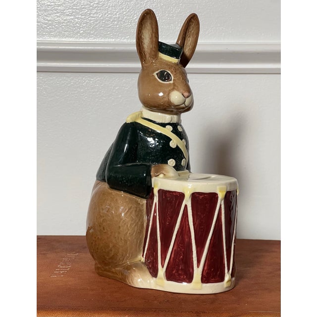 Royal Doulton Bunnybank drummer coin bank, England, 1967. Adorable ceramic brown bunny rabbit dressed in a green coat and...
