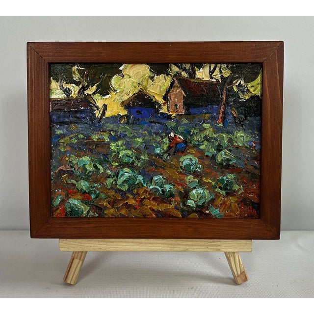 The oil painting on canvas titled ""Cabbage is Being Planted in the Garden"" beautifully captures the essence of rural...