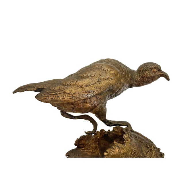 Fine French bronze sculpture of a game bird perched atop a hollow tree stump, beautifully rendered with lifelike plumage...
