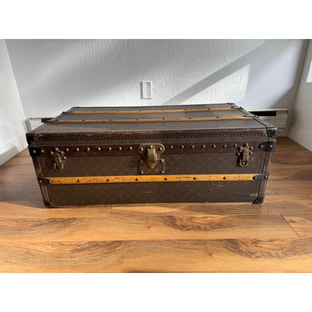An exceptional and highly collectible Louis Vuitton Cabin 100 trunk, dating to 1911, executed in the iconic monogram...