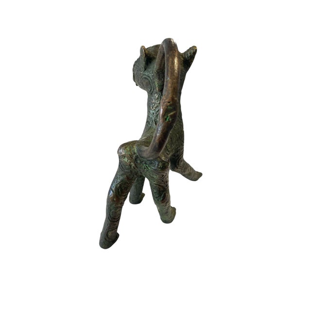 This Benin Leopard Bronze from Nigeria measures 4.5" D by 5.75" H by 3" W. It is hand made using the lost wax technique,...