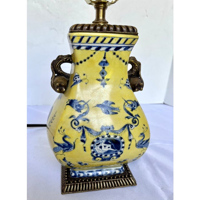 Add a striking pop of color and neoclassical elegance to your space with this vintage Italian porcelain table lamp. This...