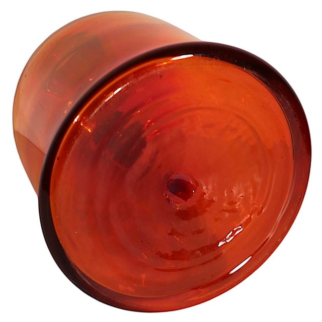 Iconic mid century art glass jug, know as the Moonshine Jug, by Blenko, circa 1972/73. The jug features an Amerina finish...