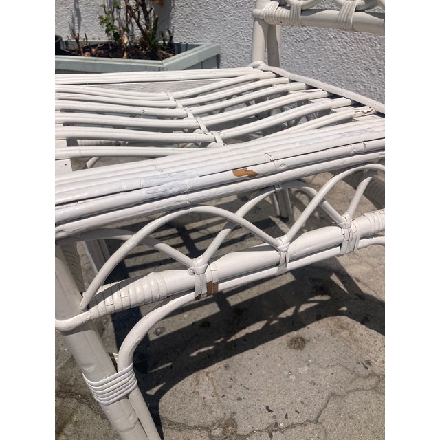 Pair of Ficks Reed Rattan Chairs in White Painted Finish. Some wear but adds to the character. Fabulous hand work and...