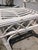 Pair of Ficks Reed Rattan Chairs in White Painted Finish. Some wear but adds to the character. Fabulous hand work and...