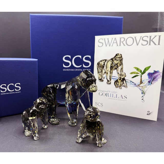 Swarovski crystal set from the SCS Annual Edition 2009 series, depicting a gorilla mother with two cubs. This piece is the...
