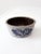 This vintage Beaumont Brothers pottery bowl, dated 1990, is crafted in salt-glazed stoneware and hand-painted with a...