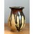 This vintage stoneware vase is a study in organic contrast, where raw clay meets rich, molten glaze. The bulbous, hand-...