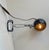 Multi-purpose light fixture with clamp mount. The shade is composed of black lacquered steel with gold-finish to its...