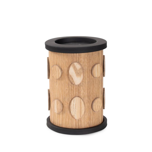 Crafted with intricate detailing, this candle holder and its rich wooden finish and matte black details it complements any...