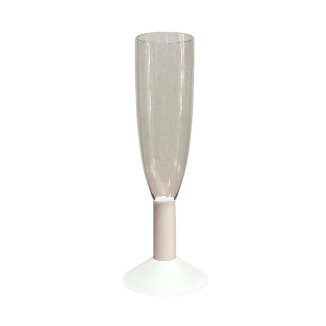 A stylish set of four vintage champagne flutes showcasing the clean, understated aesthetic of late twentieth-century...