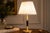 Mid-Century Modern Mid-Century Hollywood Regency Brass and Black Column Desk Lamp with Fluted Gilt Accents, Europe, 1950s For Sale - Image 3 of 11