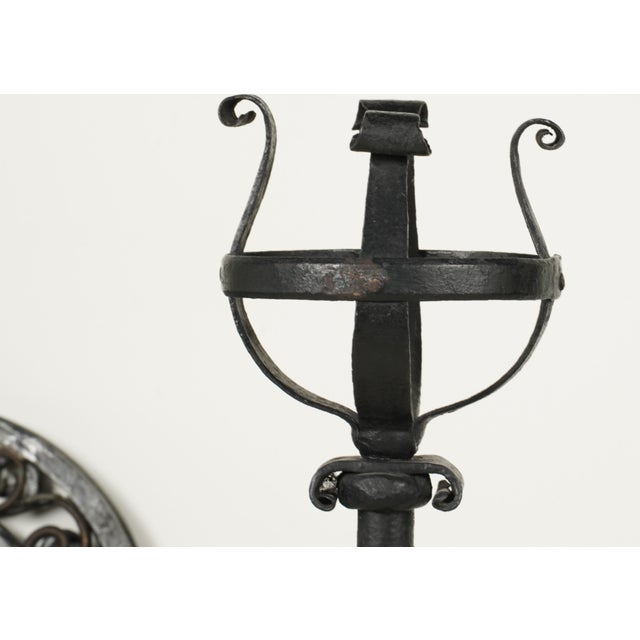 Description: A Large Pair of Spanish Revival Custom Iron Andirons with a cross bar Dimensions: 38 1/2 in. high