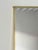 A minimalist vintage wall hanging mirror with a slim hand-wrapped brass frame. The mitred corners are typical of the clean...