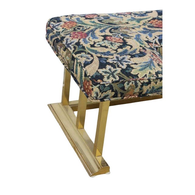 A vintage 20th century brass fire fender with a floral tapestry bench seat in U shape. Ladder style brass vertical...