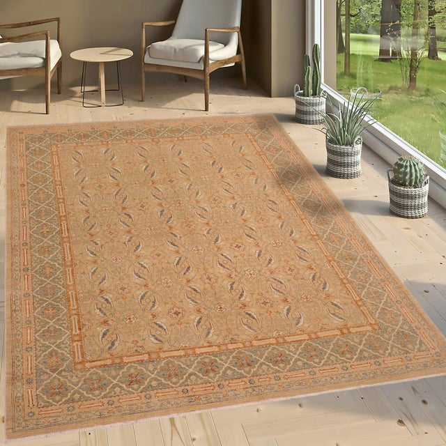 "Enhance the ambiance of your home with this magnificent Persian-influenced Turkish hand-knotted rug made by skilled...