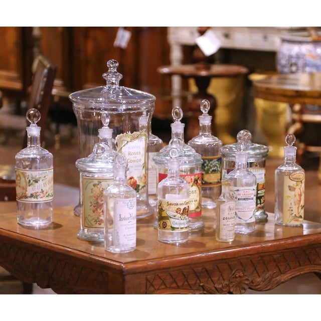 Decorate a bathroom, vanity, or powder room with this elegant collection of fourteen apothecary containers. Crafted in...