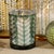 Elevate your home décor with this sophisticated set of 2 hurricane candle holders, crafted from metallic-finished glass...