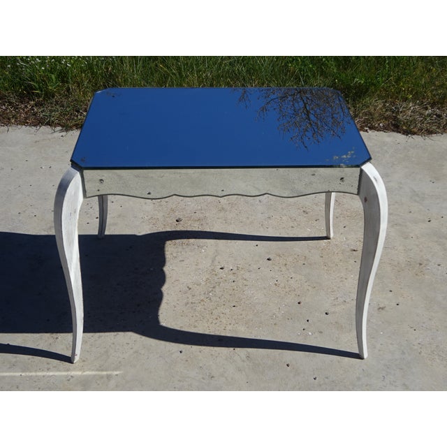 Neoclassical style coffee table. Made in the 1950s. Solid wood frame, covered with mirrored glass on the top and sides....