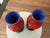 Offered are a stunning pair of vintage mid-century Chinese cinnabar lacquer vases featuring a vibrant red hue. These vases...