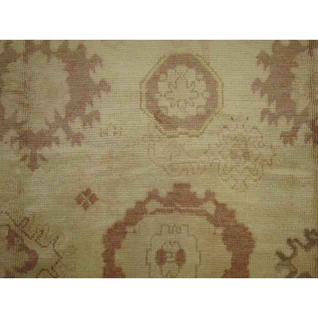 Full square one of a kind Turkish Oushak rug. Predominantly khaki and rose. The wool is luscious and soft on the feet....
