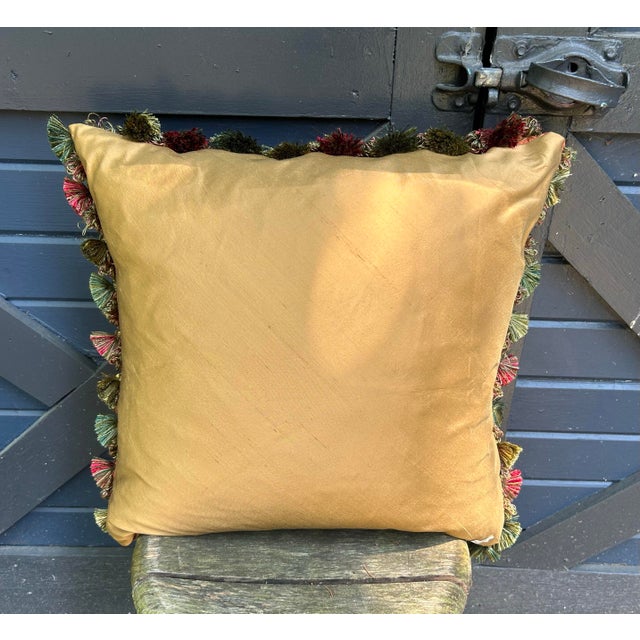 A pillow made from a sumptuous silk damask, embellished with vintage coordinating tassel fringe a down insert is included.