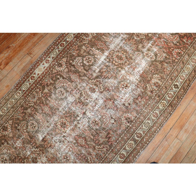 An early 20th Century soft brown rustic tone Persian Malayer Runner