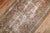 An early 20th Century soft brown rustic tone Persian Malayer Runner