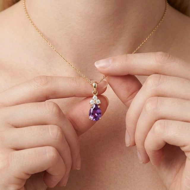 Elevate your jewelry collection with this elegant and timeless pendant necklace, featuring a captivating natural Amethyst...