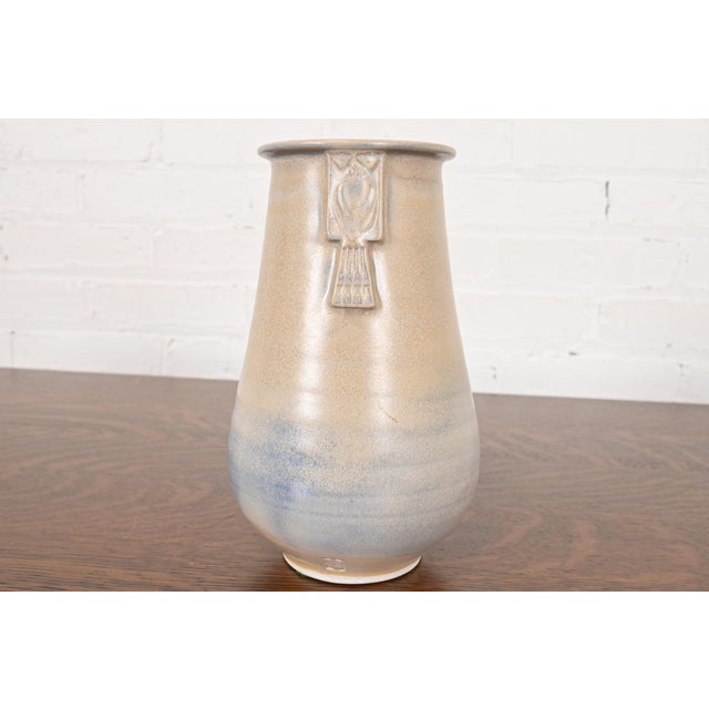 A gorgeous Arts & Crafts glazed ceramic art pottery vase By Roycroft Pottery USA, Circa Late 20th Century Glazed ceramic,...