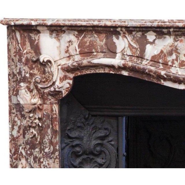 Beautiful late 18th century louis xv parisian rouge marble fireplace mantelpiece and cast-iron interior. This french...