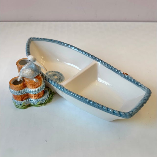 A wonderfully charming vintage paddle boat serving dish, with pelican and crab detail on the sides. The opening in the...