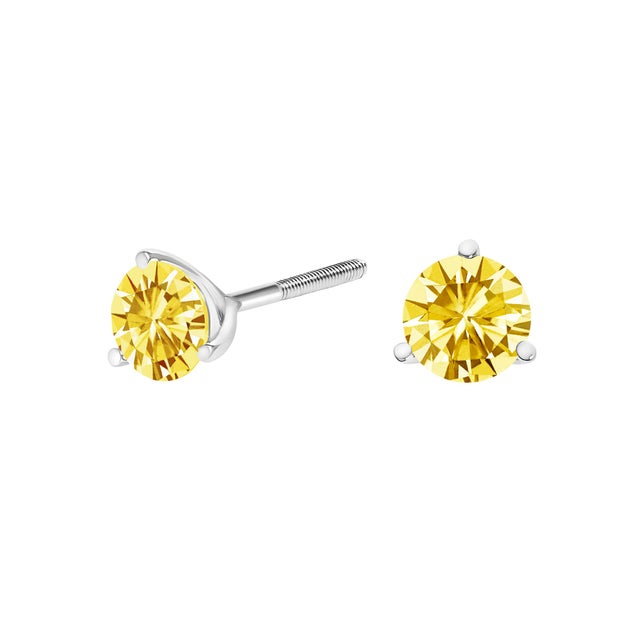 Delicately crafted for the discerning eye, these exquisite stud earrings feature a 1.5 carat total weight of vibrant,...