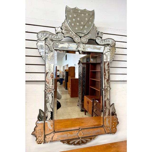 Stunning antique Venetian mirror features beautifully etched glass panels adorned with intricate floral and foliate...