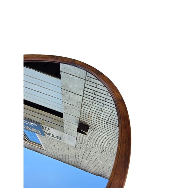 The 1940 Oval Fruitwood Mirror with New Glass is a vintage piece with a classic round shape. The mirror is wall-mounted...