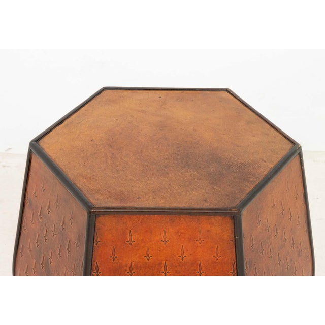 Fleur-de-Lys Embossed Leather Hexagonal Drum Stool. 20.5" H x 16.5" W x 16.5" D. Provenance: From an Upper East Side...