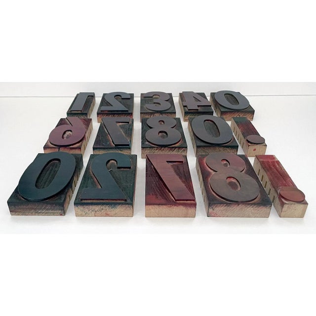 Vintage 15 piece set contains san serif numbers and decimal points. Each block has a metal character attached to a wooden...