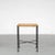 A beautiful minimalist stool, made of thin black lacquered tubular metal and a wicker seat / top. The wicker and metal...