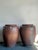 This impressive pair of large-scale stoneware jars, styled after traditional Asian or Mediterranean amphora vessels,...