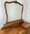 A beautifully detailed Vintage French Louis dressing table in oak, featuring elegant carved motifs, cabriole legs and a...