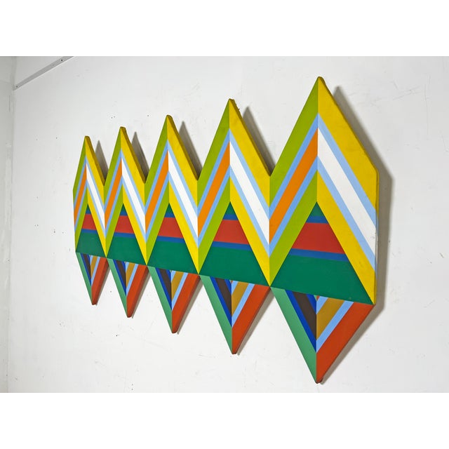 A colorful shaped op-art canvas, ca. 1960s, in the manner of Frank Stella, Al Loving, Paul Reed, etc.