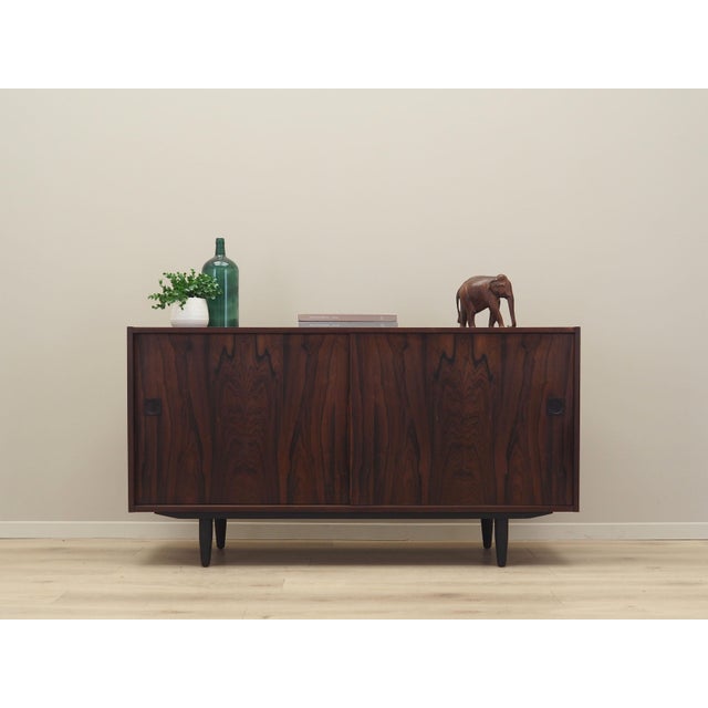 The cabinet was made in the 1970s, produced by the well-known Danish manufactory Farsø Møbelfabrik. The structure is...