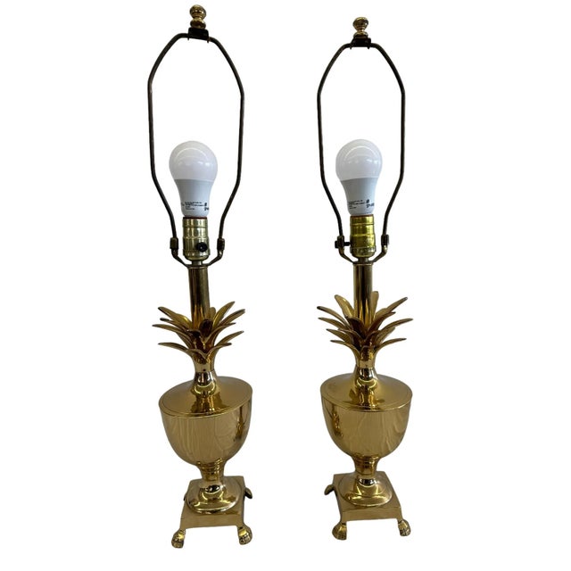 This glamorous pair of golden brass pineapple lamps are Hollywood and Palm Beach Regency inspired. This wonderful pair...