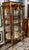 French Ornate French Louis XV Curio Cabinet – Glass Shelving, Gilded Accents & Graceful Bombe Design For Sale - Image 3 of 4