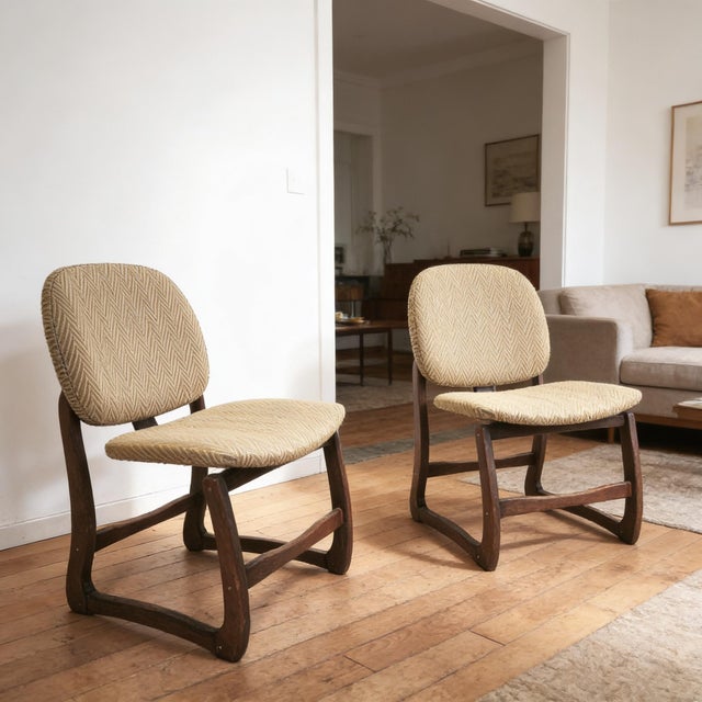 Pair of vintage lounge chairs. Wooden frame with beige fabric seat and back. In fairly good condition. Seat height 44cm....