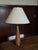 Simple, clean lines on this teak table lamp with brass accents Base: 18” tall 5” width base 31” tall with lampshade