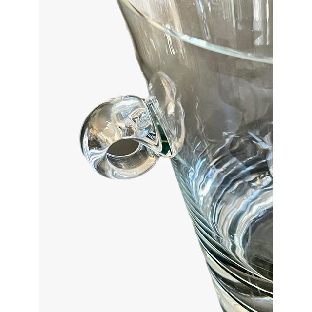 Elegant ice or wine bucket with undulating side handles. Unsigned..