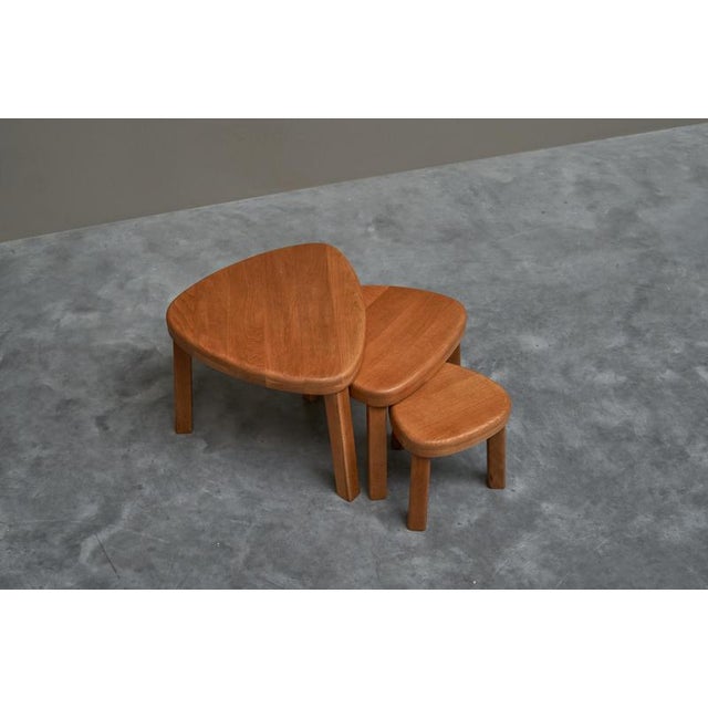 Sculptural Set of Nesting Tables in Solid Oak 1970s This is a wonderful set of sculptural nesting tables or ‘tables...